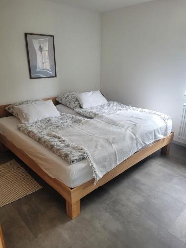 a large bed in a room with at Salinenappartement in Bad Kreuznach