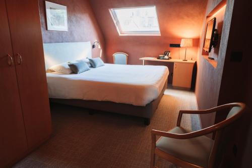 Llit o llits en una habitació de Albion Hotel