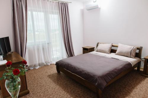 Voodi või voodid majutusasutuse Hotel Korona toas