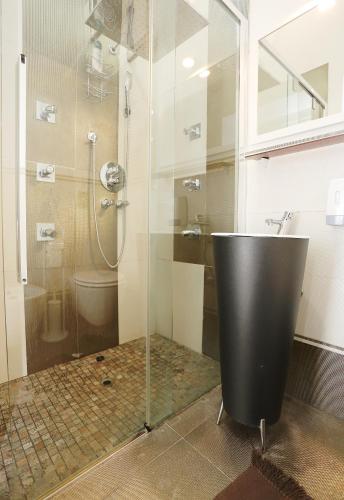 a bathroom with a shower and a sink and a tub at Rest and Go in Palermo