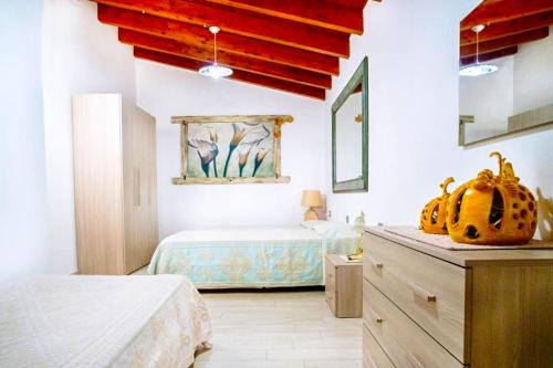 a bedroom with a bed and a table with a pumpkin on it at Villa Chia 2 in Chia