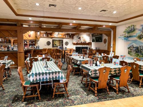 a restaurant with tables and chairs in a room at Bavarian Inn Lodge in Frankenmuth