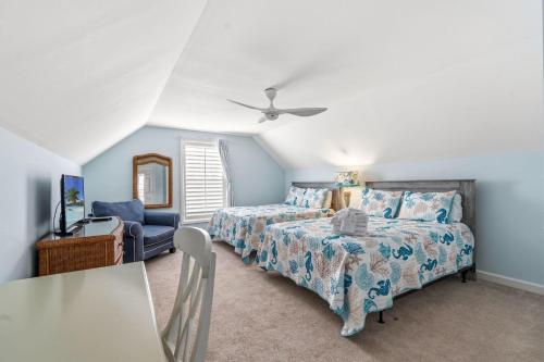 a bedroom with a bed and a ceiling fan at Antigua Breeze - 3rd Row - Windy Hill Section in Myrtle Beach