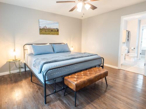 a bed in a room with a ceiling fan at Haven Hill House - Scenic Getaway near Bardstown & Bourbon Trail in Springfield