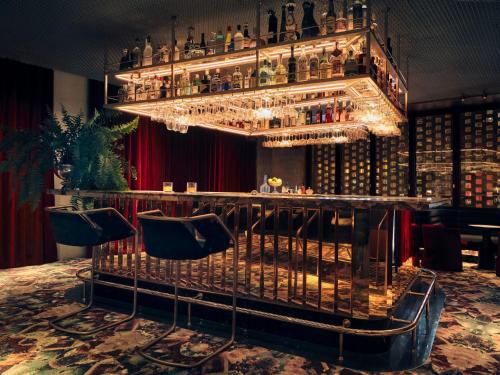 a bar with a lot of bottles of alcohol at Bus Palladium in Paris