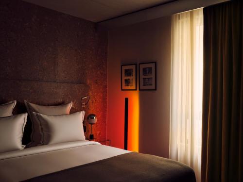 a bedroom with a bed and a window at Bus Palladium in Paris