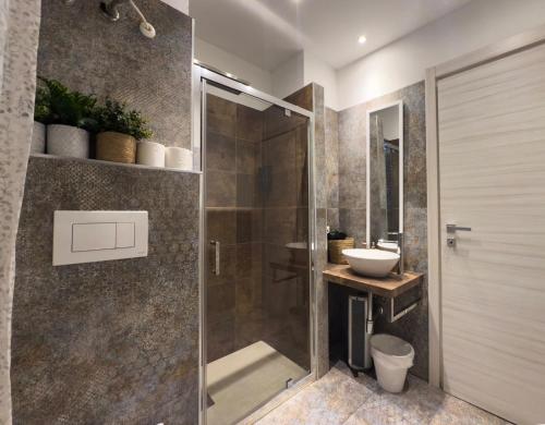 a bathroom with a shower and a sink at BelSorrisoVarese - Rooms & Apartments - Private Parking - Reservation Required in Varese