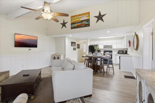 a living room with a couch and a table at Working 9 to Pine by Beyond Expectations with Views in Sevierville