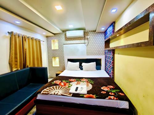 a bedroom with a bed with a phone on it at Hotel O Royal in kolkata