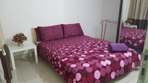 En eller flere senge i et værelse på D'Kroll Vega Residensi Cyberjaya 1 Bedroom Suite