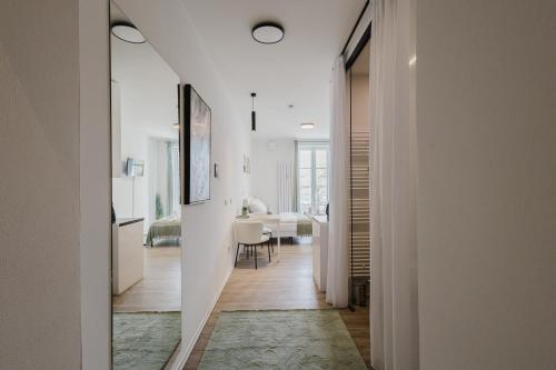 a hallway with a living room and a dining room at Design-Studio mit Balkon - Nähe Donau in Passau