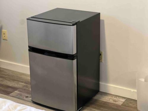 a black and silver refrigerator in a room at Stay with Jay - Quarta Suite in Cleveland