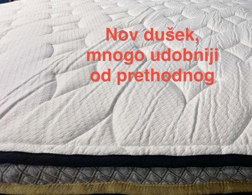 a close up of a white mattress with the words new dixlip mojo at Stan na dan Flower in Šabac