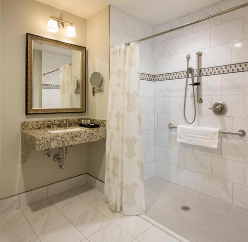a bathroom with a shower and a sink at The Washington House Hotel & Restaurant in Sellersville