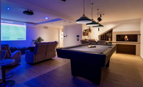 Casa Vita featuring a sea view, billiards, and heated pool