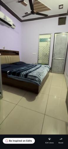 a bedroom with a bed in a room at Platinum hotel in Bhucho