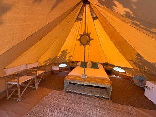 a large tent with a table and chairs in it at Camping Paxariñas in Portonovo
