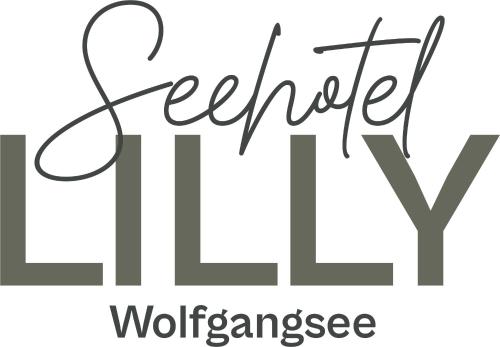 a black and white sign that says volunteer workurance at Seehotel Lilly in Strobl