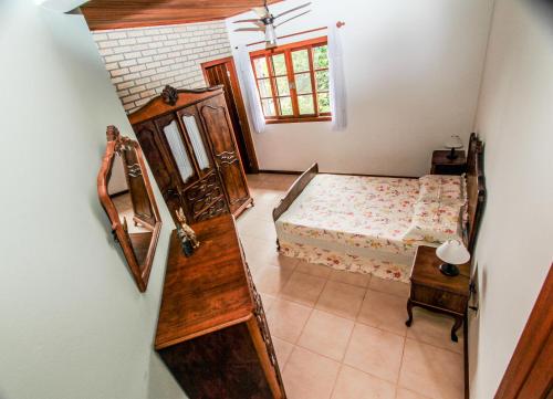 Tempat tidur dalam kamar di Entre a Lagoa e o Mar