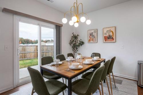 a dining room with a table and chairs at Spacious Farragut 5BR FamilyGroup Getaway near UT in Knoxville