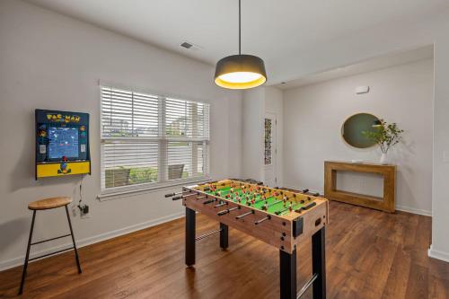 a room with a foosball table in the middle at Spacious Farragut 5BR FamilyGroup Getaway near UT in Knoxville
