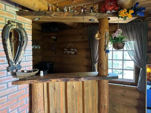 a wooden counter in a room with a window at Mõnus palkmaja Muhu mändide all in Nõmmküla