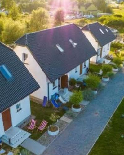 an overhead view of a house with a black roof at Mistral Jarosławiec in Jarosławiec