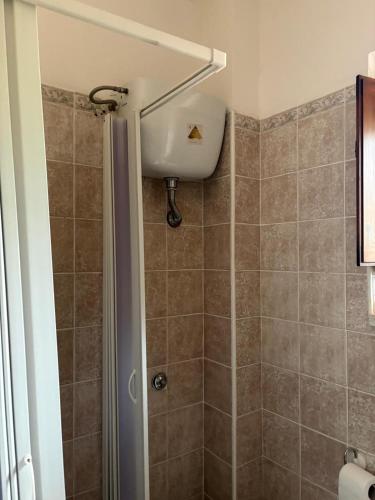 a bathroom with a shower with a shower curtain at La Dimora del Molo in Fuscaldo