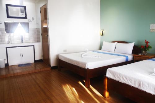 Postel nebo postele na pokoji v ubytování Vitton Resort
