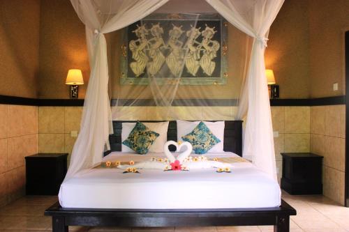 Кровать или кровати в номере Pondok Shindu Guest House