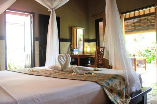 Кровать или кровати в номере Pondok Shindu Guest House