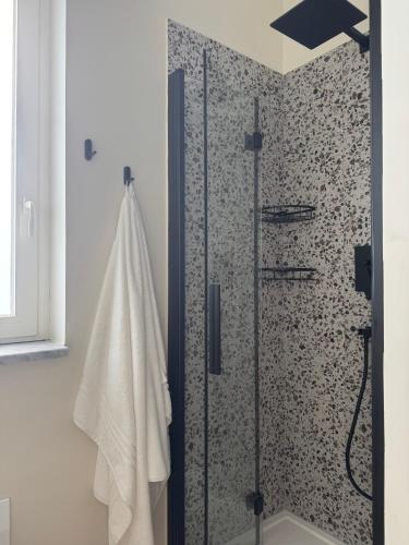 a shower in a bathroom with a shower curtain at Villa Perla in Battipaglia