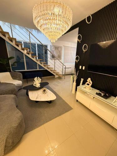 a living room with a couch and a table at Oasis in San Isidro