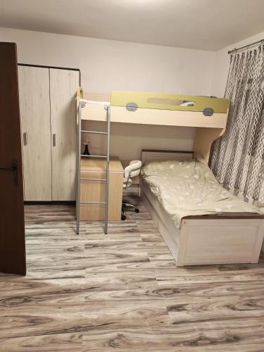 a bedroom with a bunk bed and a bunk bed at Apartman T&N in Šušnjari