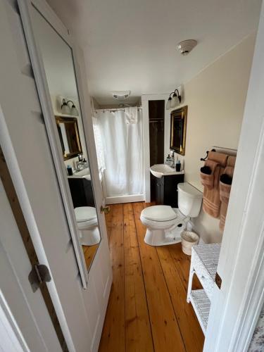 a bathroom with a toilet and a sink at The Greenfield Inn in Greenfield