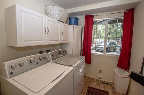 a kitchen with a washing machine and a window at Trailside Escape By Hauserman Rentals in Tahoe City