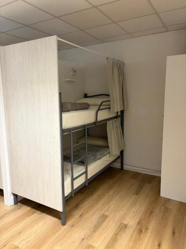 a room with two bunk beds in a room at Albergue Porta Real NO BIKE STORAGE in Santiago de Compostela
