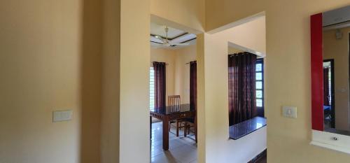 a view of a room with a dining room at Roca vista villaas vagamon in Vagamon