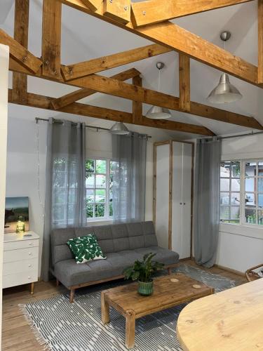 a living room with a couch and a table at The Red door cottage in Pretoria