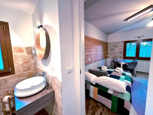 a bathroom with a sink and a toilet at La Baita Del Cervo 2 in Castel di Sangro