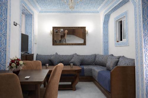 a living room with a couch and a table at Tangier city center 1 in Tangier