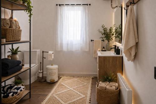 a bathroom with a sink and a toilet at Villa Oasys in Almería