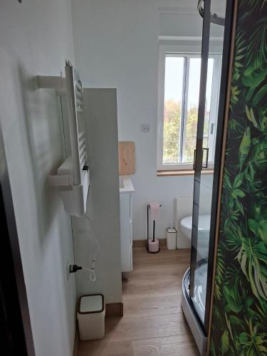 a bathroom with a shower with a fish tank at horizon doux in Calais