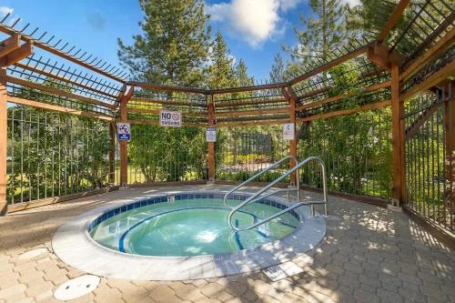 a hot tub in the middle of a patio at Cozy Bear's Lair in Tahoe City