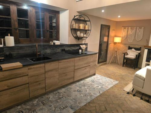a bathroom with a sink and a room at Hacienda La Celada CARMONA SEVILLA in La Celada