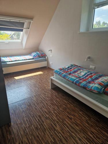 a bedroom with two beds and a window at Monteurs Wohnung in Andervenne in Andervenne Oberdorf
