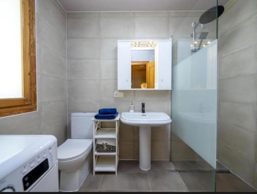 a bathroom with a sink and a toilet and a shower at Altea Hills Best Seaview in Altea