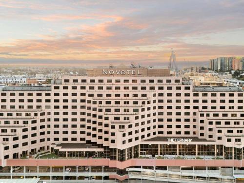a large white building with a no world sign on it at Novotel Sydney Darling Harbour in Sydney