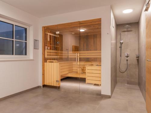 a bathroom with a shower and a sink at Pinzgau Lodge 2B in Wald im Pinzgau