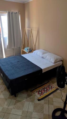 a large bed in a room with at Casa 89 in Itacaré